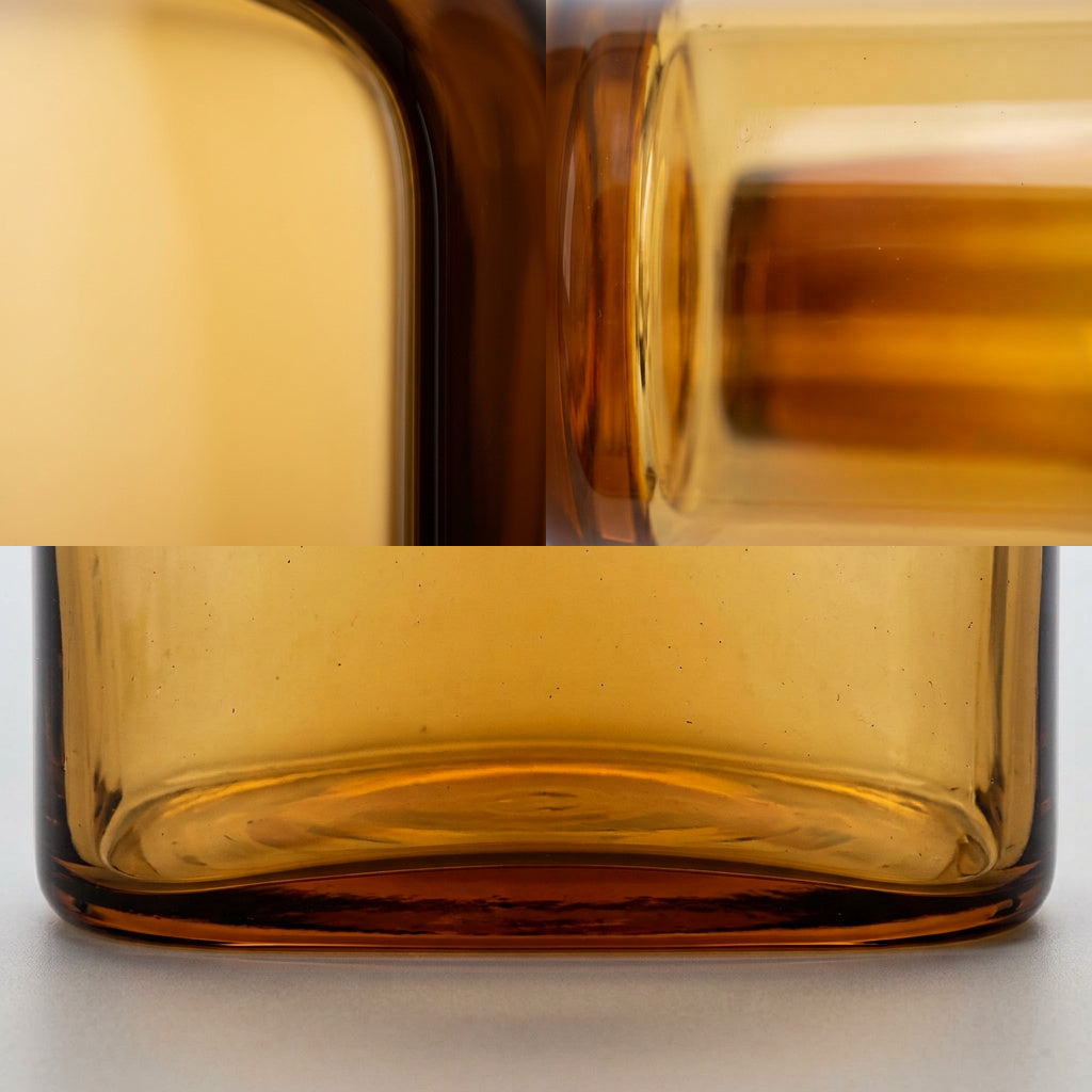 VELUM Vase im Detail, gerundete Kante und Boden aus bernsteinfarbenem Kristall – Lorenz Laurent Home